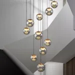 Серия подвесных светильников с LED-источниками света в полусферических рассеивателях с эффектом льда внутри шарообразных плафонов из тонированного стекла MAYER ORB L13 от ImperiumLoft