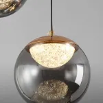 Серия подвесных светильников с LED-источниками света в полусферических рассеивателях с эффектом льда внутри шарообразных плафонов из тонированного стекла MAYER ORB L13 от ImperiumLoft