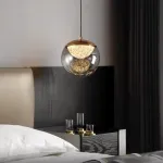 Серия подвесных светильников с LED-источниками света в полусферических рассеивателях с эффектом льда внутри шарообразных плафонов из тонированного стекла MAYER ORB L13 от ImperiumLoft