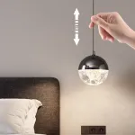 Серия подвесных светильников с LED-источниками света в полусферических рассеивателях с эффектом льда внутри шарообразных плафонов EMMERT Gold