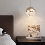 Серия подвесных светильников с LED-источниками света в полусферических рассеивателях с эффектом льда внутри шарообразных плафонов EMMERT Gold