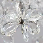 Серия инсталляций из подвесных хрустальных цветов, подсвеченных светодиодными источниками, расположенными на прямоугольном креплении CHARA L100 от ImperiumLoft