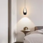 Серия подвесных светильников оригинальной формы с LED-подсветкой по внутреннему контуру и направленным вниз линзированным источников света CAJUS Black