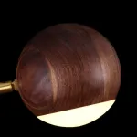 Серия светодиодных подвесных светильников с тремя шарообразными плафонами из дерева на вертикальной латунной стойке NARVE Light Brown