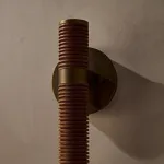 Серия настенных светильников с обтянутом кожей рельефным корпусом и белым шарообразным плафоном SOLF WALL Black