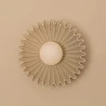 Серия настенных светильников с вогнутым рельефным корпусом из керамики и шарообразным плафоном в центре STEVEN Green от ImperiumLoft