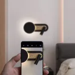 Серия настенных светильников в виде комбинации диска с LED подсветкой и поворотного спота на общем удлиненном креплении MAC Black от ImperiumLoft