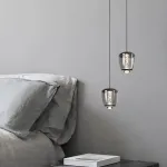 Подвесной светильник с комбинацией декоративной LED подсветки воздушных пузырьков внутри прозрачного плафона и направленного сквозь оптическую линзу света EDIS