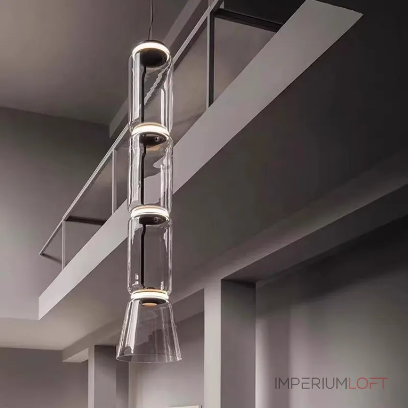 Серия подвесных светильников из прозрачных стеклянных скругленных цилиндров c LED подсветкой сверху и снизу QUENTIN A H32 от ImperiumLoft Серия подвесных светильников из прозрачных стеклянных скругленных цилиндров c LED подсветкой сверху и снизу QUENTIN A H32 от ImperiumLoft