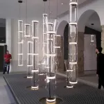 Серия подвесных светильников из прозрачных стеклянных скругленных цилиндров c LED подсветкой сверху и снизу QUENTIN C H149 от ImperiumLoft