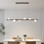 Подвесной рядный светильник с чередующимися белыми шарообразными плафонами и декоративными шариками красного цвета REIK LONG WHITE от ImperiumLoft Подвесной рядный светильник с чередующимися белыми шарообразными плафонами и декоративными шариками красного цвета REIK LONG WHITE от ImperiumLoft