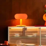 Серия настольных светодиодных ламп со стеклянным тороидальным плафоном на центральной стойке KIDDY Orange