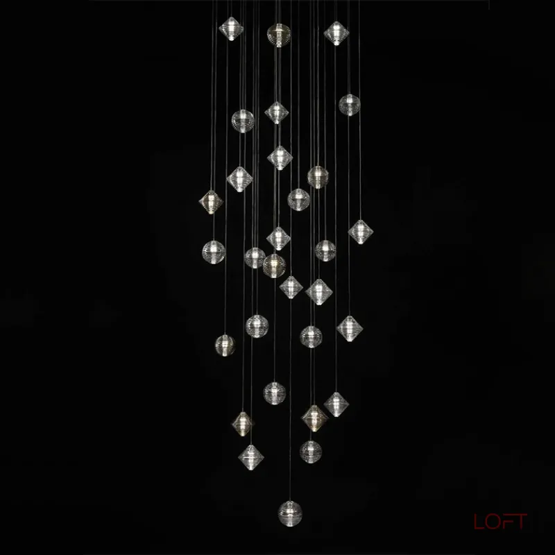 Каскадный светильник с комбинацией из 30-ти стеклянных подвесов в форме призм и сфер с концентрическим рельефом STYRK COMBO от ImperiumLoft Каскадный светильник с комбинацией из 30-ти стеклянных подвесов в форме призм и сфер с концентрическим рельефом STYRK COMBO от ImperiumLoft
